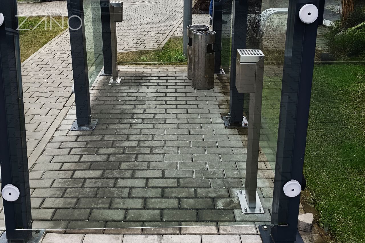 Standing outdoor ashtray screwed to the ground
